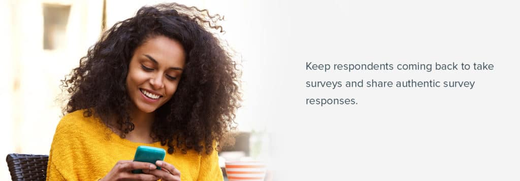 women on her phone looking at survey