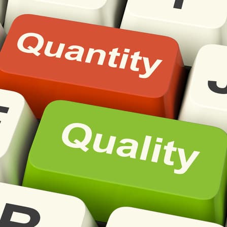 Quality And Quantity Computer Keys Showing Choice Between Excellence Or Numbers